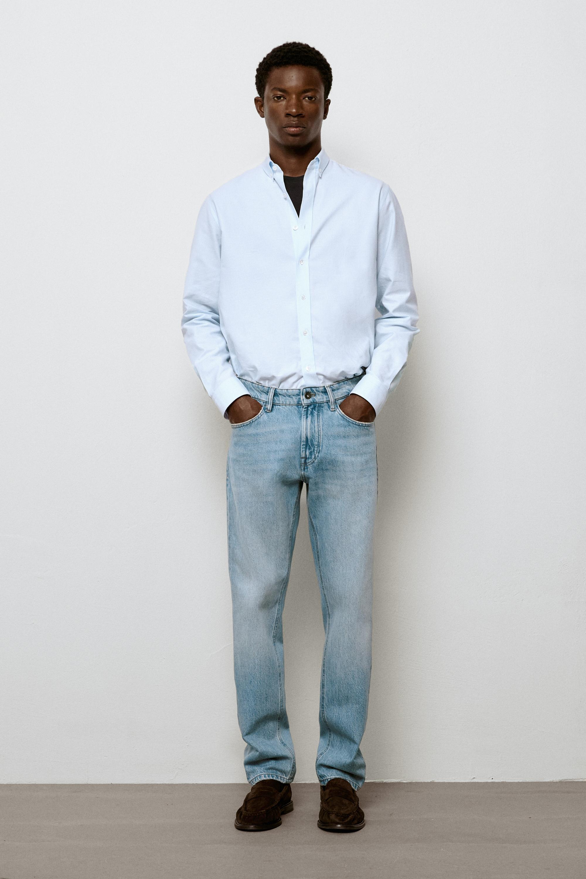 Bleach washed tapered fit jeans